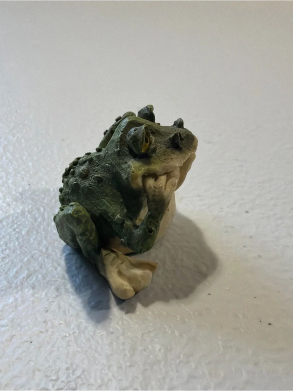 Porcelain Frog Statue 1 inch tall With A Goofy Look On His Face